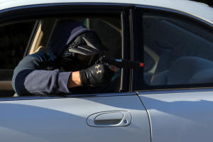 Richmond Police Department detective Mauricio Canelo left, as a civilian driver, shoots at Richmond police officer Enrik Melgoza with an air pistol during